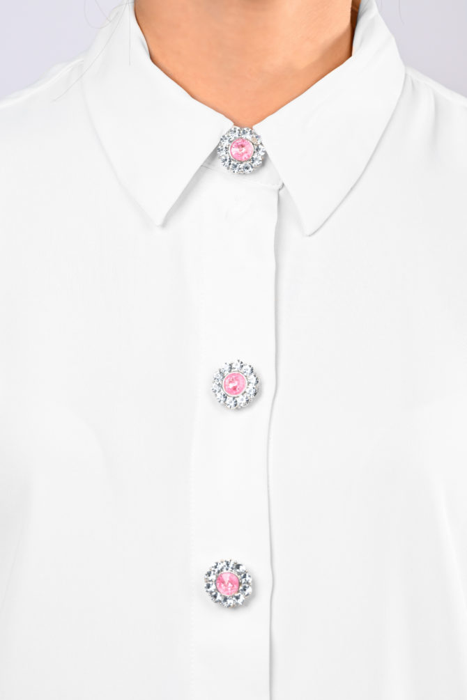 flower shaped button cover with rhinestones and a pink center by Avrel.