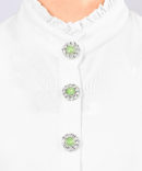 flower shaped button cover with rhinestones and a green center by Avrel.