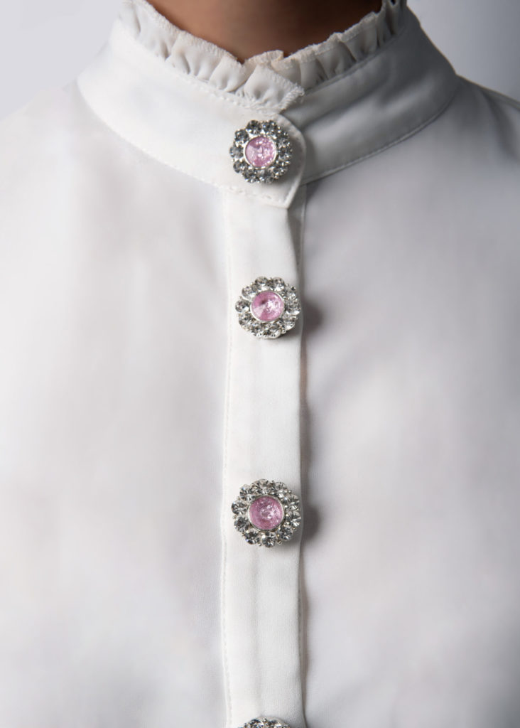 A shirt after using pink rhinestone button cover jewelry by Avrel